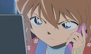 Haibara on phone.jpg